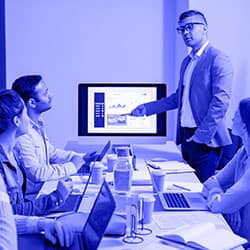 A man presenting to a group of people, discussing Case Studies.