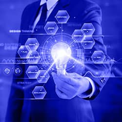 A professional man in a suit confidently holds a light bulb, symbolizing innovation and bright ideas.